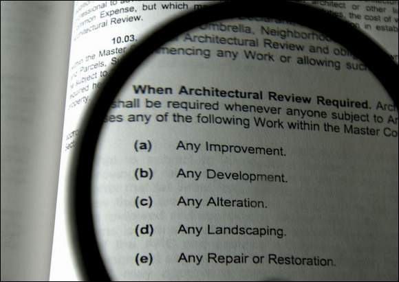 06/04/03 ( Staff Photo by Michael Diemer), (Sarasota Herald Tribune)**Digital Image --This page from the Supplemental Master Declaration to Amended and Restated Master Declaration of Covenants, Conditions and Restrictions for the Tara subdivisions lists when architectural review is required.